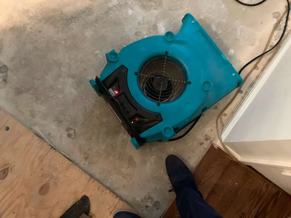 Air mover drying subfloor during Commercial Water Damage Restoration in Fountain Hills